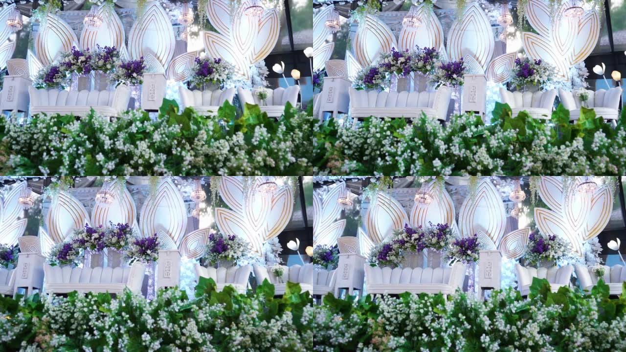 婚礼开始了。印度尼西亚婚礼上的鲜花装饰。印尼婚礼活动的舞台背景
