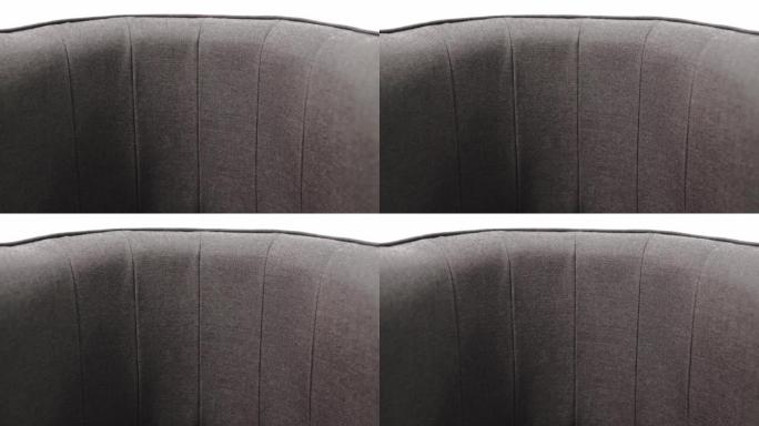 用昂贵的织物制成的时尚设计师椅子的软垫。