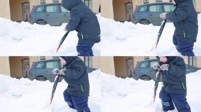 一个小男孩正在移除snow