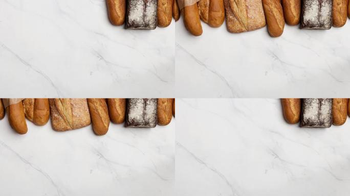 白色大理石背景上不同类型面包的连续定格外观