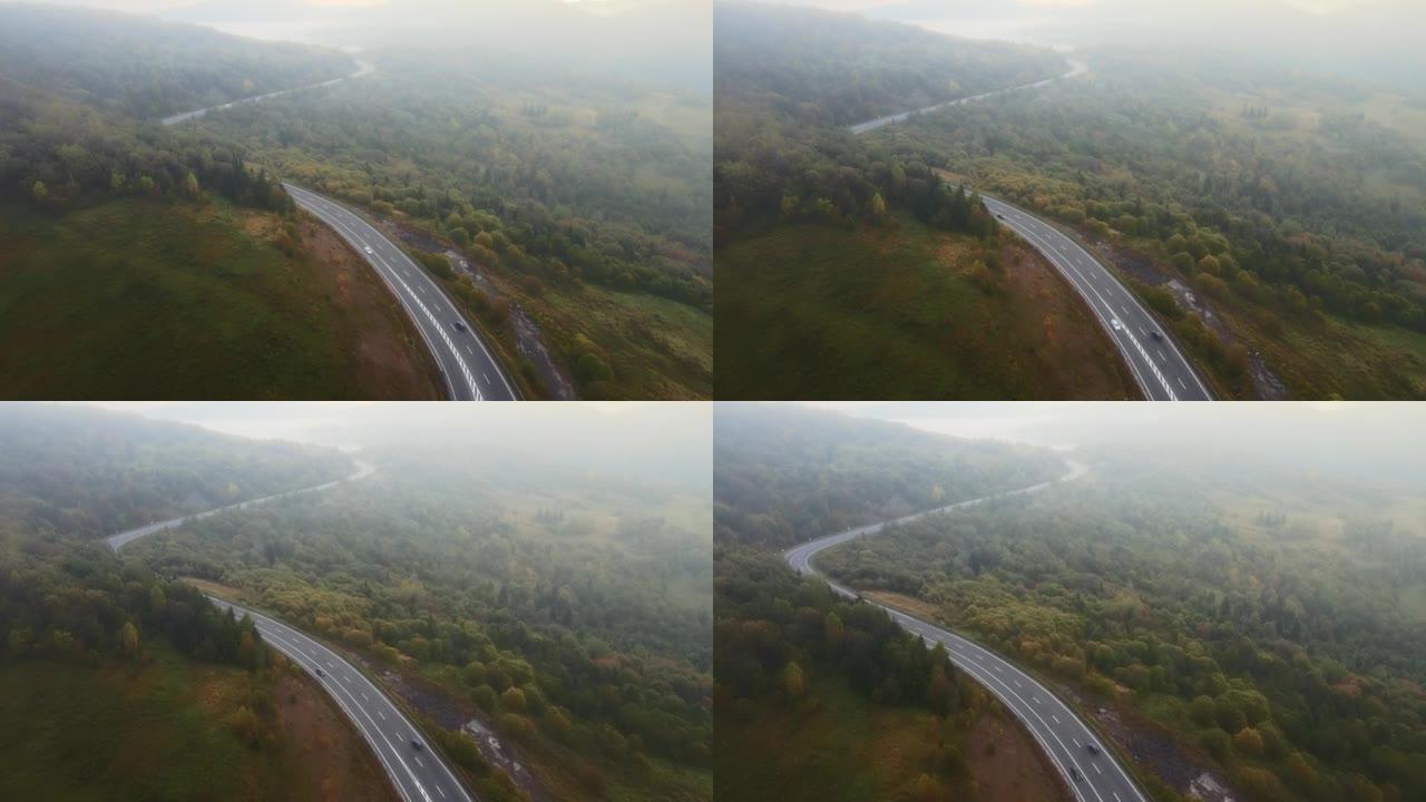 无人机空中秋晨山路，孤车笼罩在浓雾中