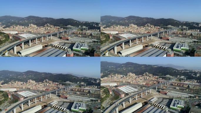空中拍摄一座以热那亚城市景观和山脉为背景的桥梁
