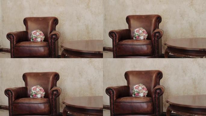 棕色豪华皮革扶手椅上新娘花束的特写镜头