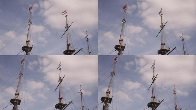 乌云密布的天空下，荷兰阿姆斯特丹的一艘船的帆