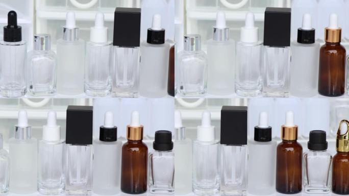 白色背景上的美容产品瓶或血清瓶