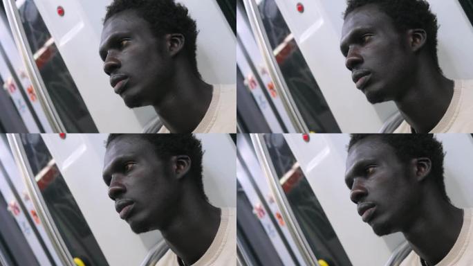 地铁上紧张疲惫的非洲裔男子工作一天后要回家休息