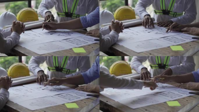 多民族工程师、建筑师讨论建造计划。工程师致力于成功的工程师蓝图的规划和团队合作思想。4k视频