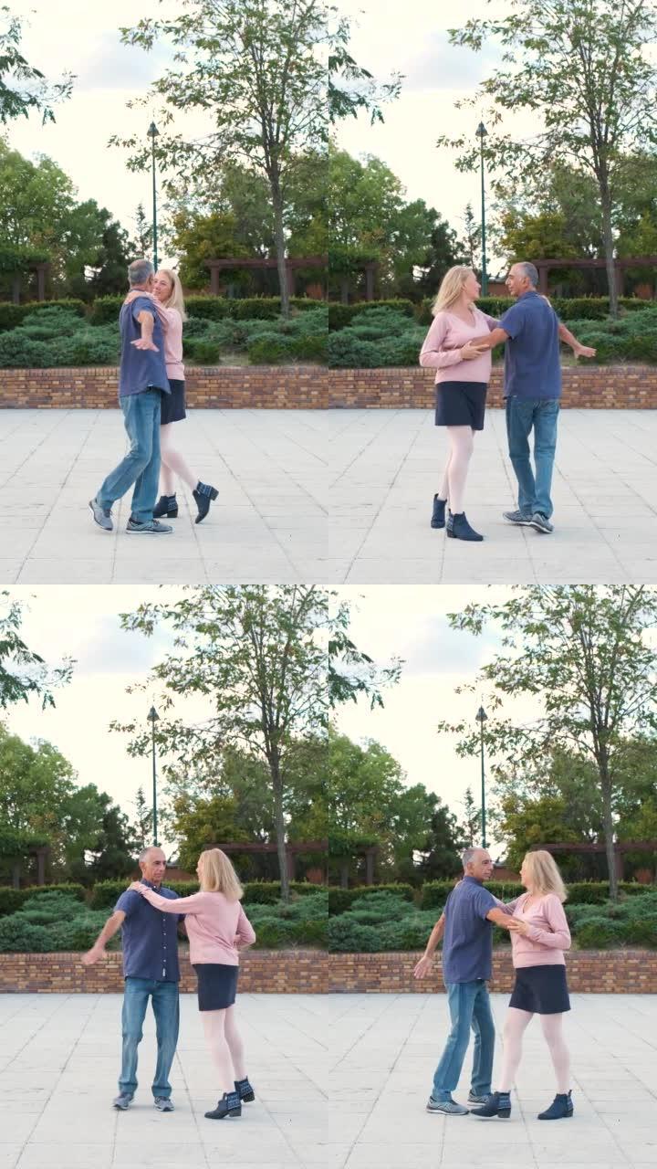 成熟的夫妇在街上的公园里跳探戈。