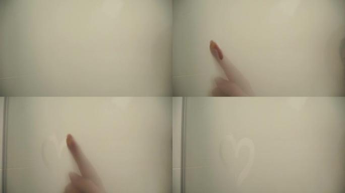 有人用手指在窗户上画一颗心的镜头