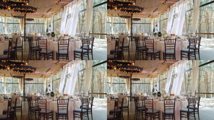 乡村风格的婚礼桌布置装饰。婚宴上的桌子和椅子。婚礼装饰品慢动作。