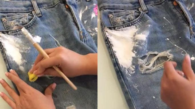 女性在撕裂的牛仔裤上画花的工作过程的延时