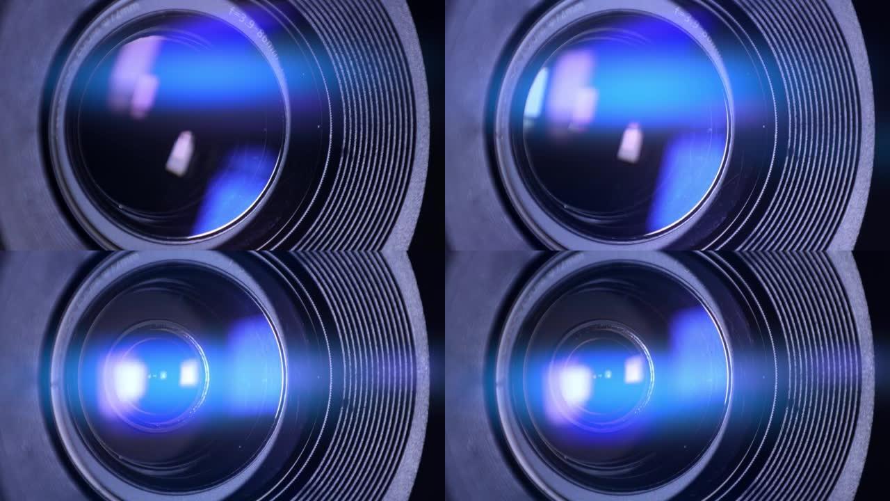 光学玻璃上有光斑的相机镜头的宏观拍摄。相机镜头的变焦过程