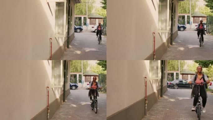 骑自行车去顾客前门的年轻女子快递员