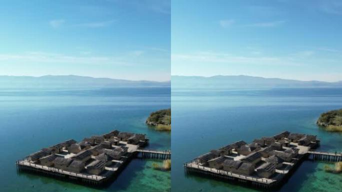 北马其顿奥赫里德湖边缘的历史青铜时代定居点的垂直视频 (空中4k无人机镜头)