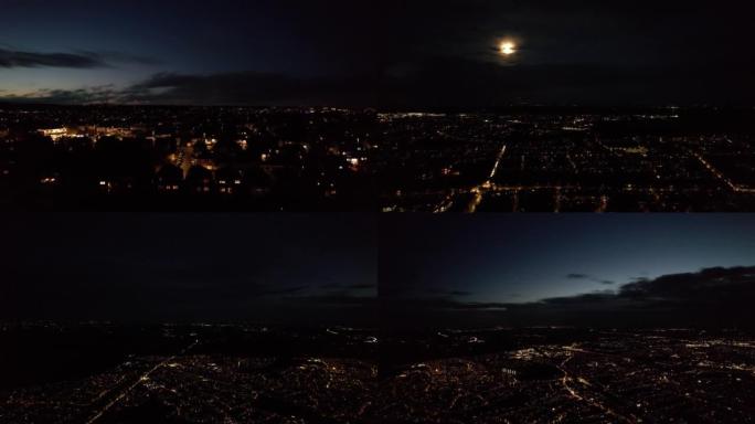 夜间照明城市的最佳鸟瞰图。日落之后和月亮升起开始的精彩镜头