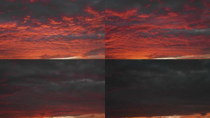 傍晚日落云的4k延时镜头，戏剧性的红云在天空上滚动，最后变成黑暗。
