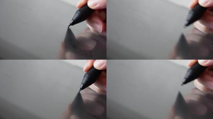 女人的手拿着笔手写笔，用数字绘画艺术家平板电脑制作插图。数字艺术家工作和艺术过程概念。特写微距拍摄