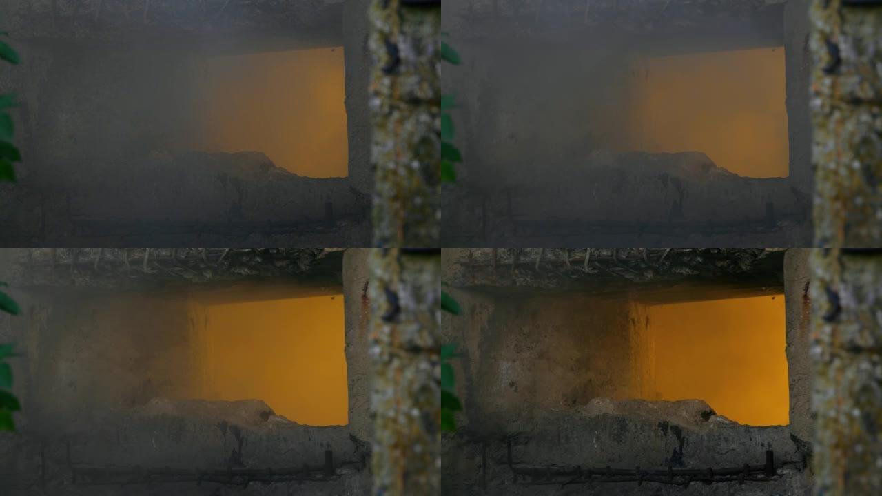 在通往掩体的旧混凝土墙上的一个洞周围冒烟