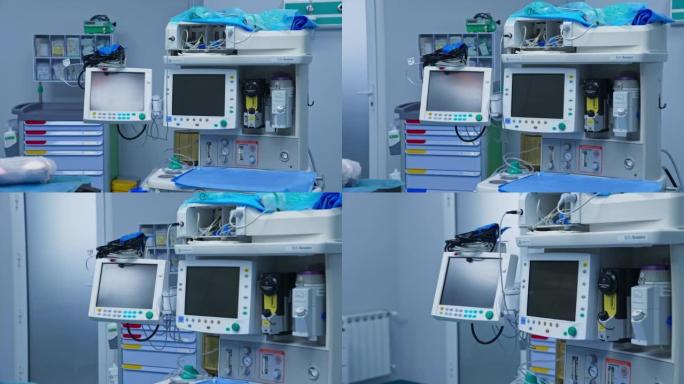 手术室中有两个屏幕的先进设备。手术室里有许多管子的技术设备。
