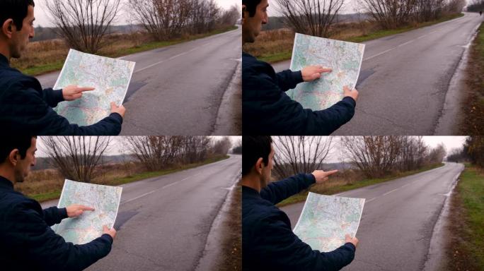 地图上的那个人正在看道路。选择性聚焦。自然。