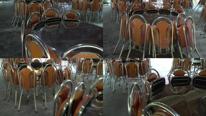空咖啡馆里堆放的椅子和桌子。