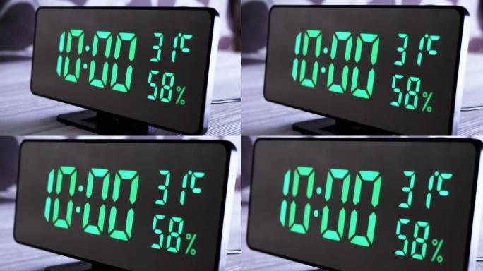 数字时钟在绿色显示上午10:00上显示时间、温度、空气湿度