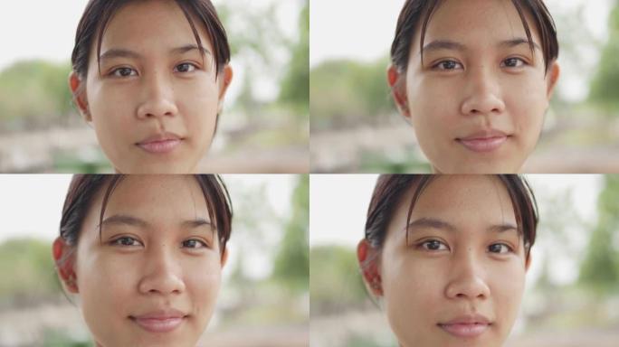 面对自然化妆的亚洲美女，看着相机，慢动作