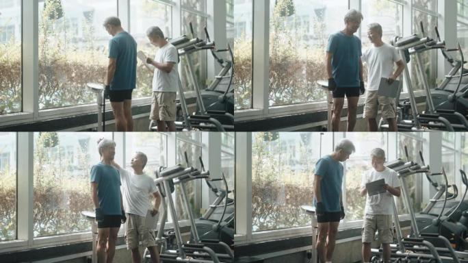 亚洲中国健身教练在健身房测量老年人身高和体重