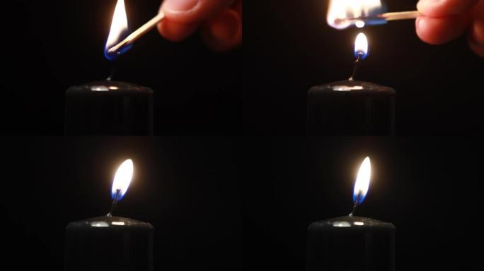男人的手在深色背景上使用火柴点燃黑色石蜡蜡烛。明亮的火焰，火，点火。记忆、仪式、庆祝、电力问题、能源