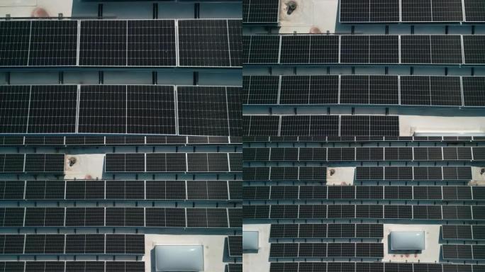 无人机飞行飞越屋顶上的太阳能电池板可再生绿色替代能源。自上而下的无人机视图。飞向上升