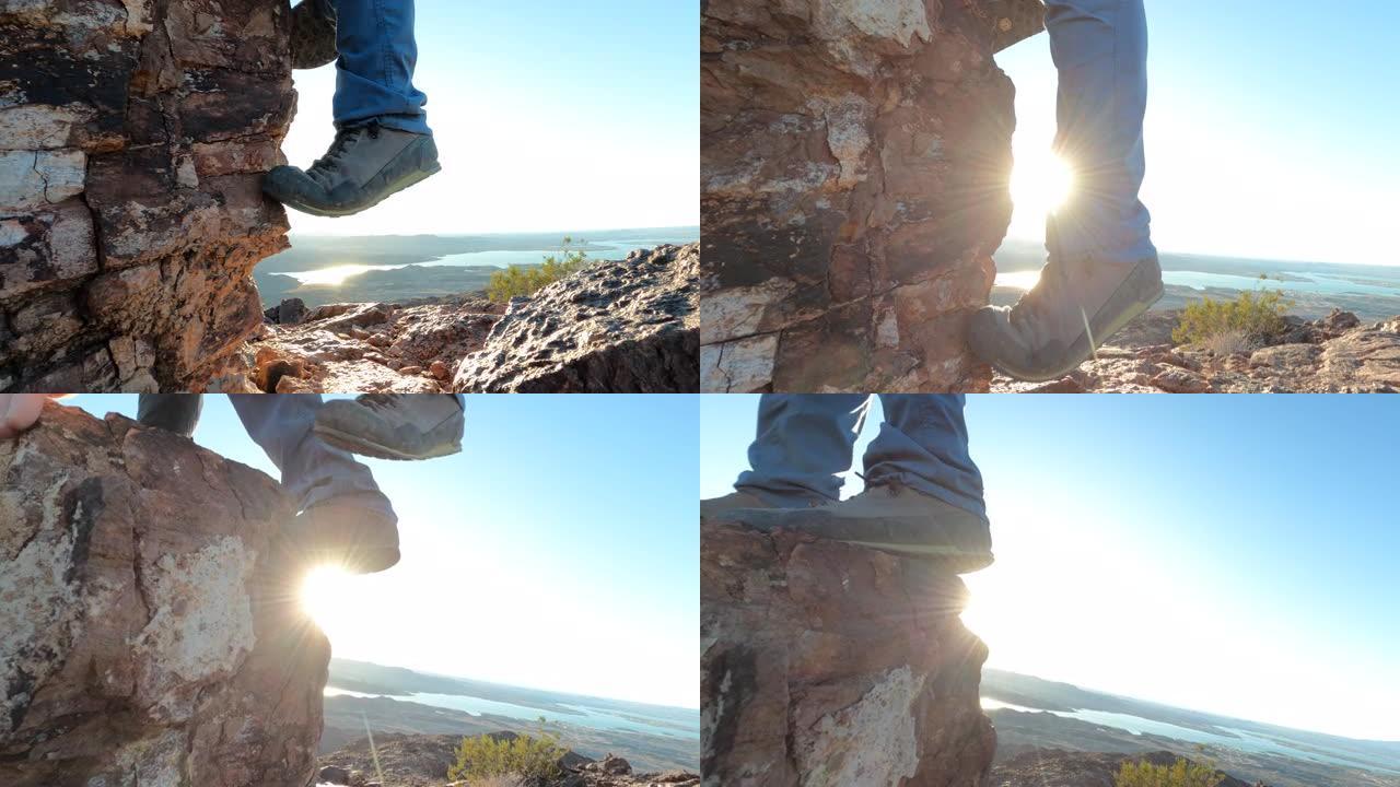 徒步旅行者的腿上升岩石虚张声势的特写视图