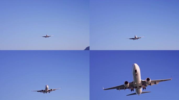 飞机在充满活力的蓝天下飞行。飞向相机