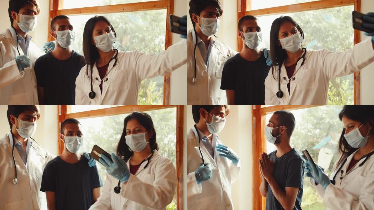 4k的年轻南亚医生与患者合影