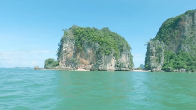 泰国攀牙湾的青色海水和平静的海浪与热带夏岛天堂山雨林