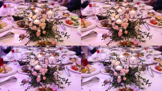 婚礼上餐厅节日餐桌上的鲜花装饰