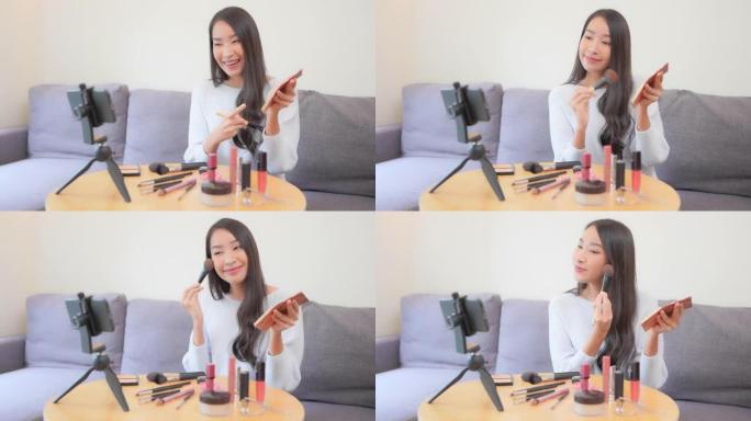 年轻的亚洲女性在互联网上评论化妆品