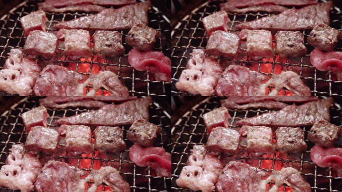 关闭多汁的生肉牛肉片烧烤牛排木炭烤架与火焰烟，日式烤肉烧烤烤架在餐厅