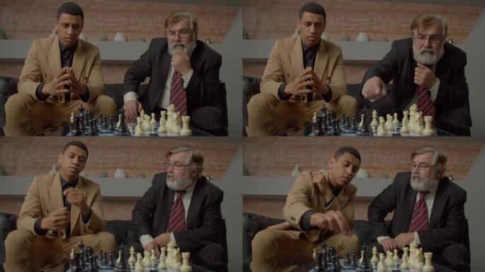 多元化的多民族商业同事在国际象棋比赛中思考移动