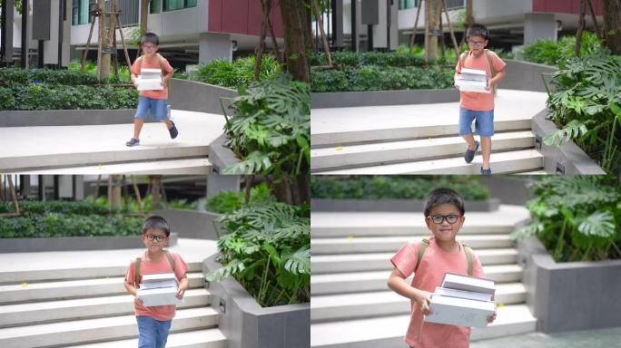 亚洲学校男孩背着书上学，有创作空间和建筑。