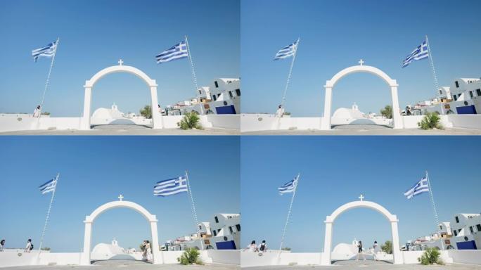 拱门和两面希腊国旗，伊亚，圣托里尼，希腊
