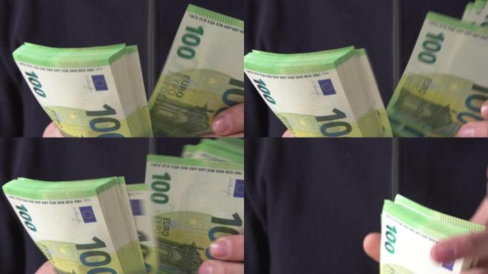 以名义的千欧元纸币计算欧元现金。手头拿着现金。欧罗巴金融概念。关闭选择性聚焦。