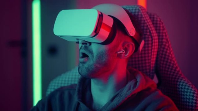使用虚拟现实眼镜看电影的人。男子在玩VR游戏时用手进行滑动和触摸动作