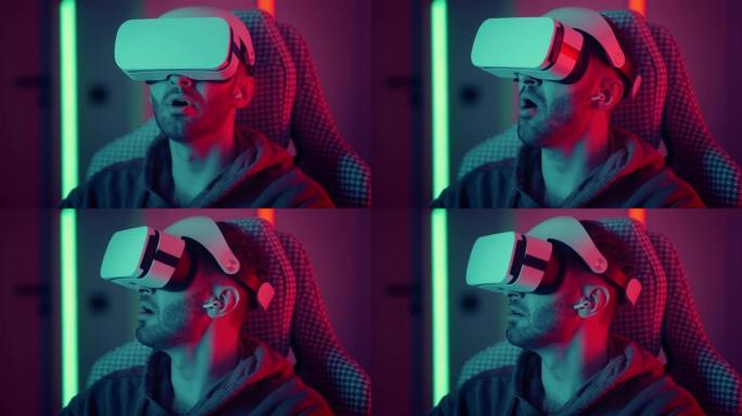 使用虚拟现实眼镜看电影的人。男子在玩VR游戏时用手进行滑动和触摸动作