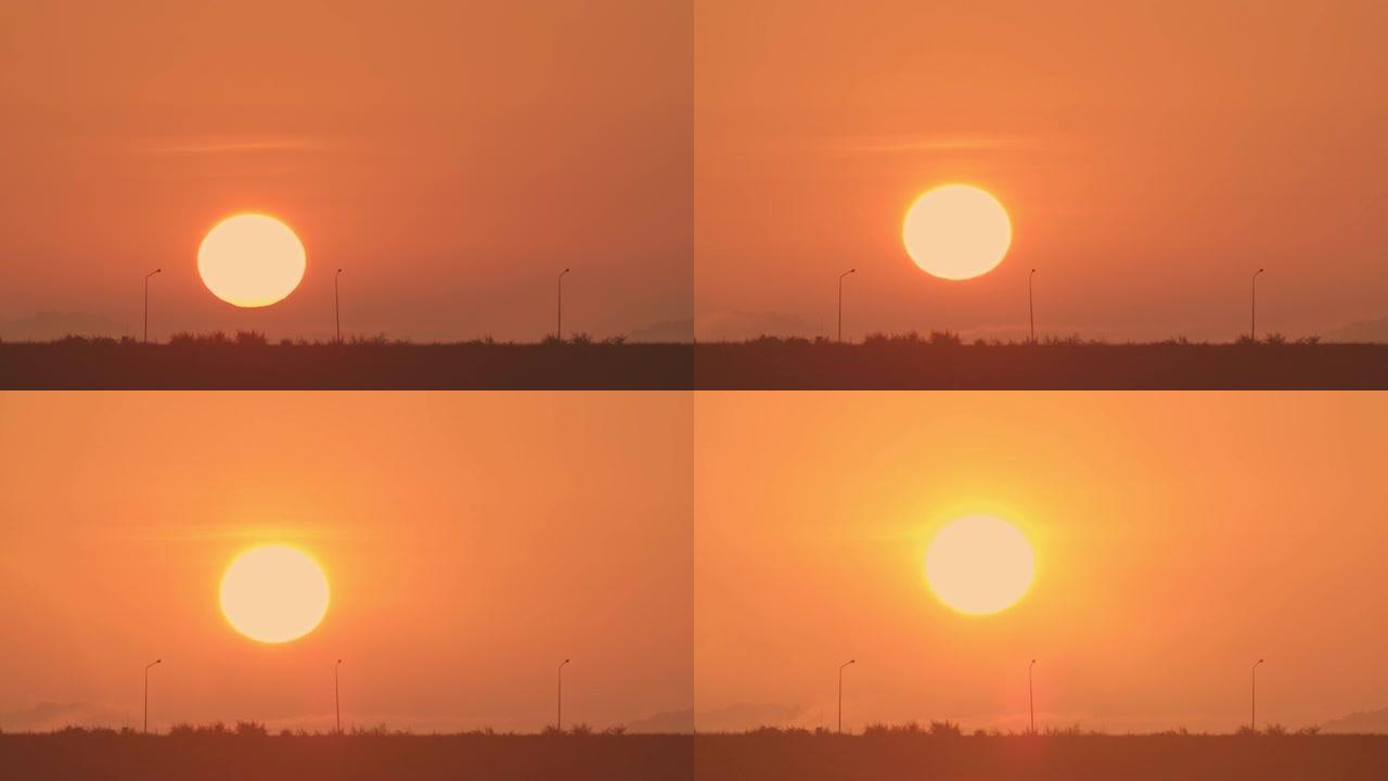 早晨黎明的标志是大太阳从地平线上方逐渐升起。在冬天的早晨，太阳在朦胧或雾蒙蒙的天空中升起。自然景观上
