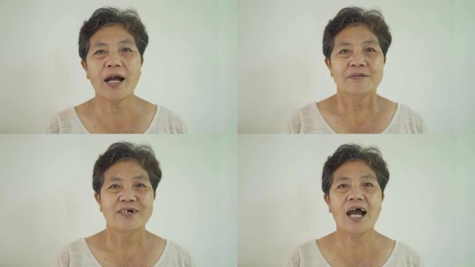 老年亚洲泰国妇女的肖像孤立在白色背景上微笑。人们的生活方式。资深祖母。医疗保健概念中的患者。