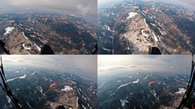 滑翔伞飞越冬季森林山脉自然，自由肾上腺素冒险