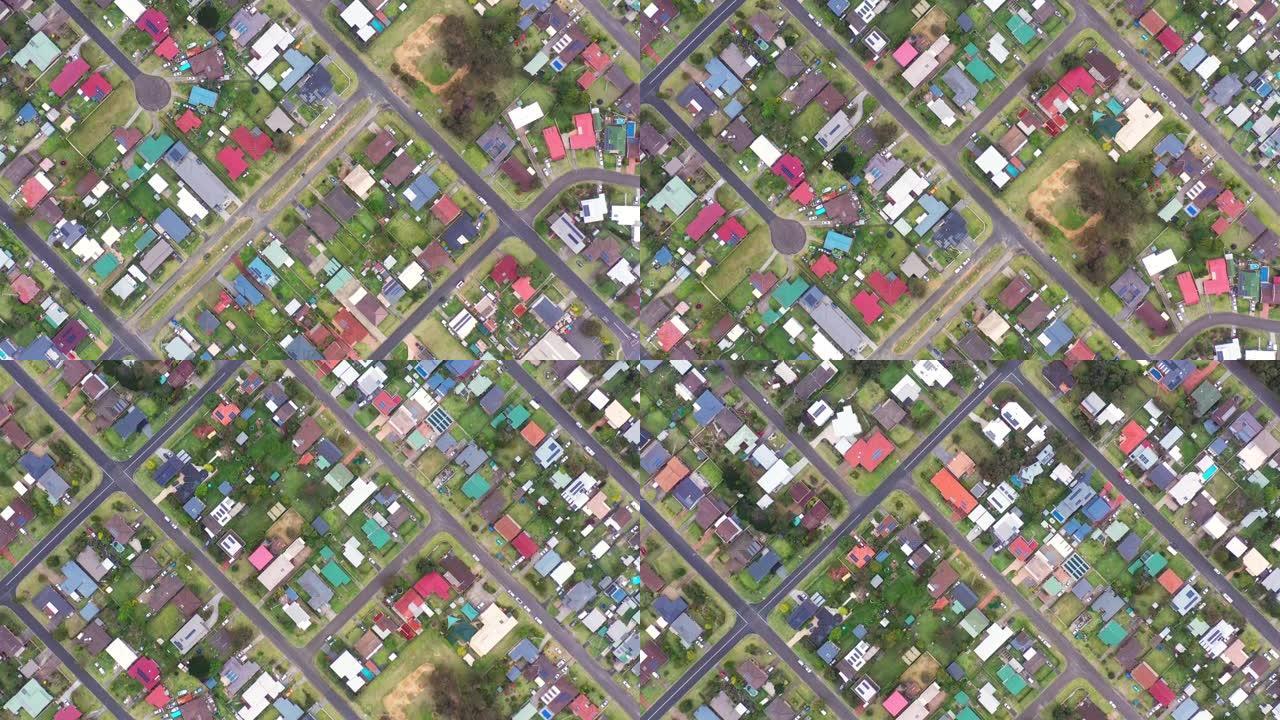 郊区住宅和道路基础设施正上方的空中透视
