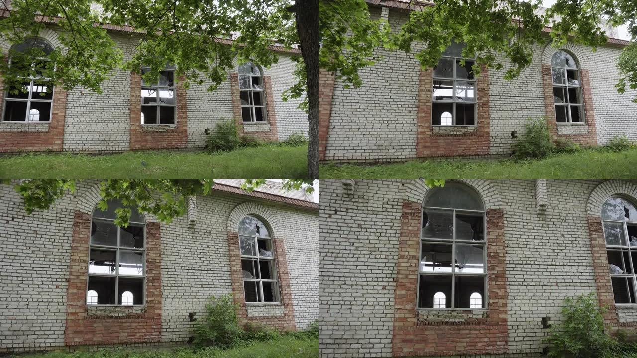砖墙被毁，窗户玻璃被砸碎。