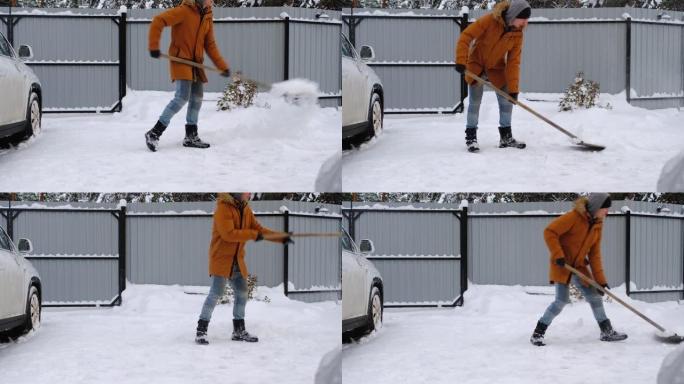 一个冬天的人在停车场的一所房子的院子里用铁锹扫雪。降雪天气条件恶劣汽车熄火挖开通道