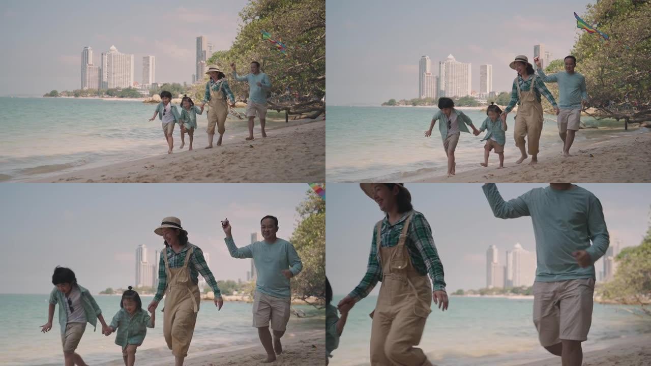 快乐的亚洲家庭在海滩上享受暑假。